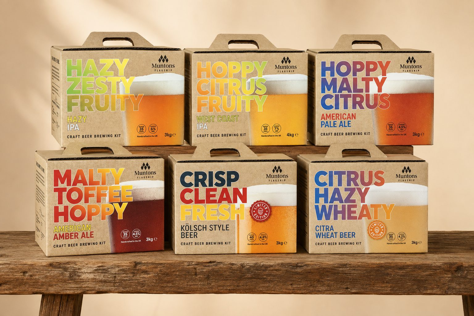 The six Muntons Flagship kraft carry-boxes on a wooden bench: Hazy IPA, West Coast IPA, American Pale Ale, American Amber Ale, Kolsch Style Beer and Citra Wheat Beer, each with its stacked three-word flavour descriptor and a glass of the beer.